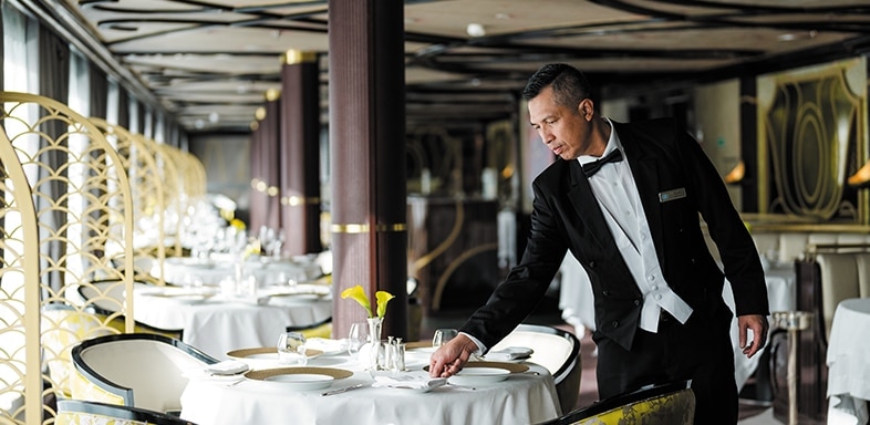 Regent waiter showcasing the value of ultra-luxury