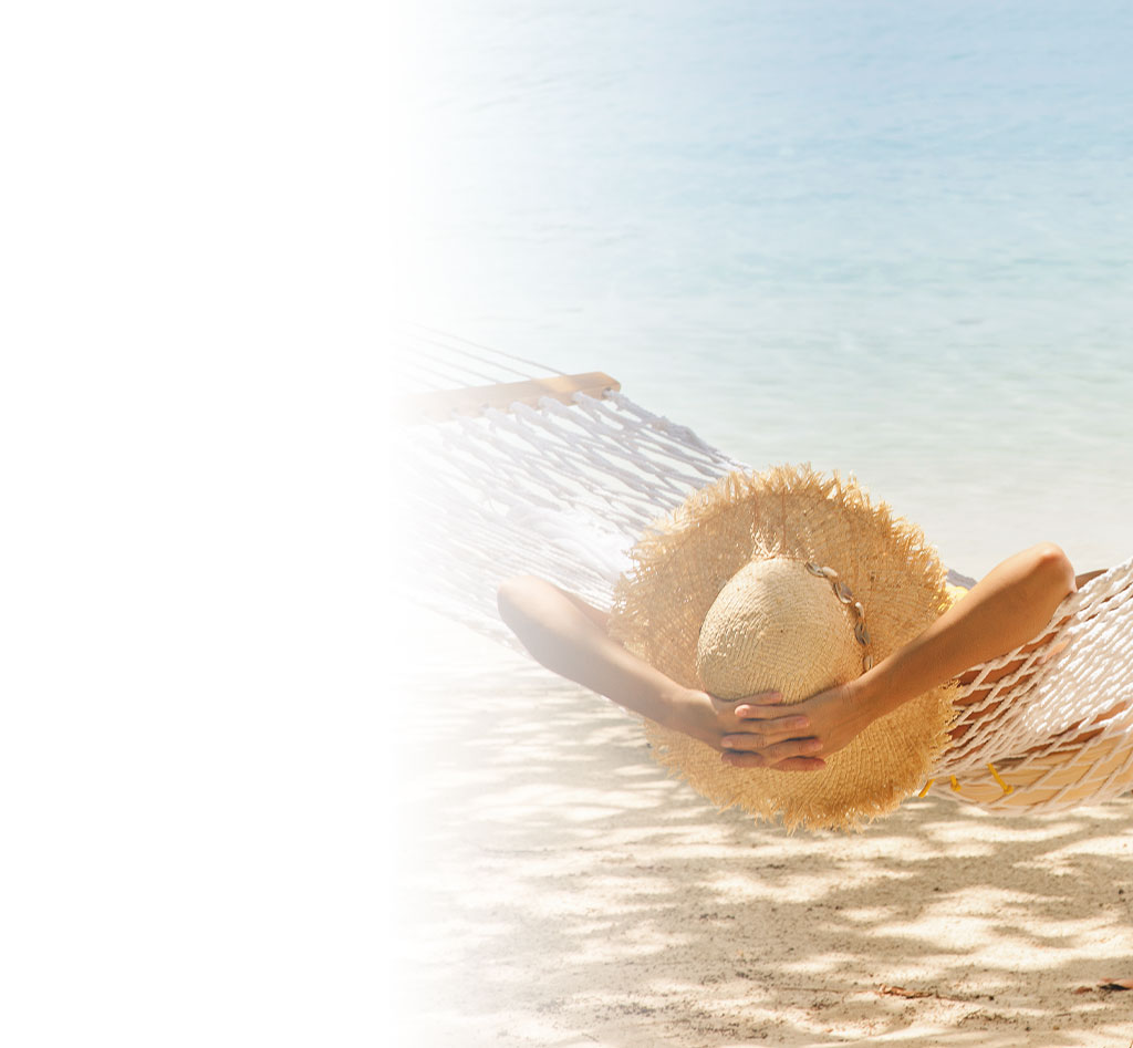 woman lounging under the sun at the beach