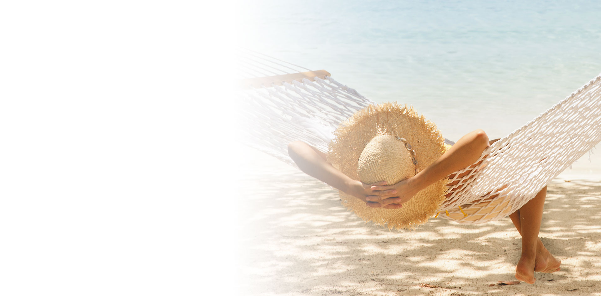 woman lounging under the sun at the beach