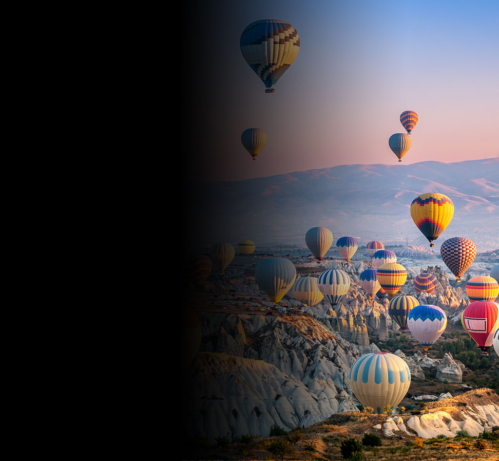 Hot air balloons flying in the sunset